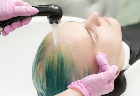 Hairdresser hands wash hair of customer with green 2025 02 12 03 34 29 utc 1