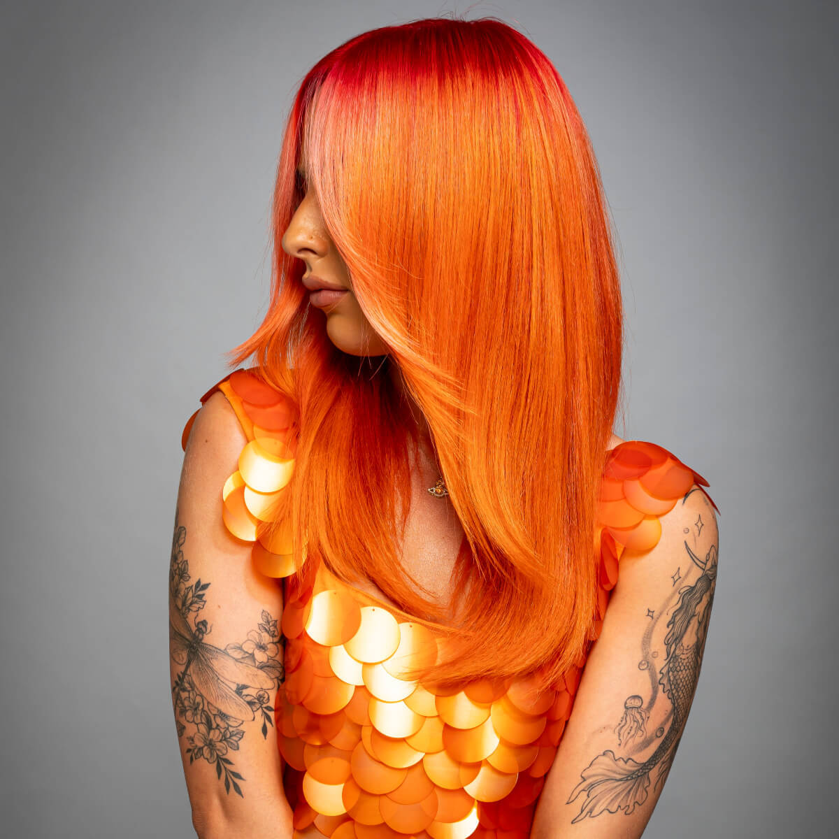 A custom shade of orange hair colour used by mixing Apricot, Peach and Poppy Red hair dyes, all produced by Directions Hair Colour